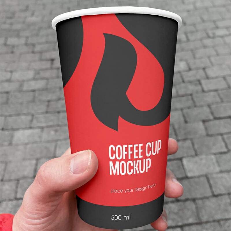 Free Tumbler Coffee Cup In Hand Mockup