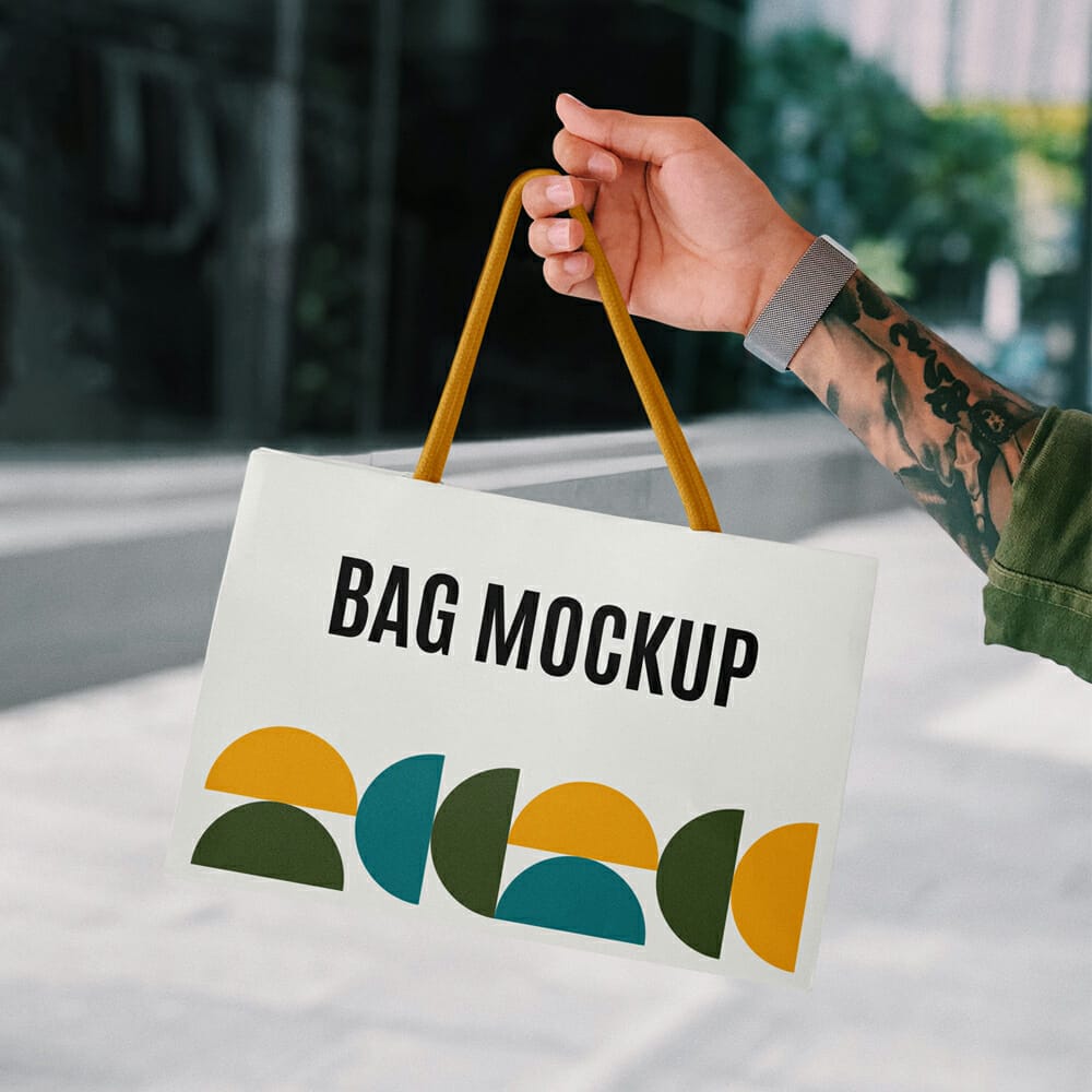 Hand Holding Mini Shopping Bag Mockup