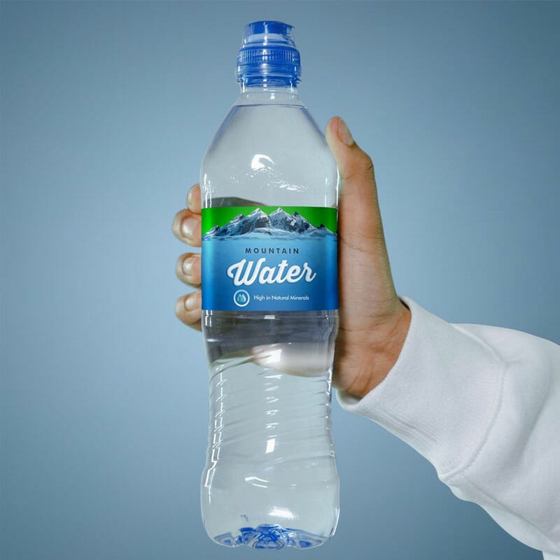 Free Hand Holding Water Bottle Label Mockup PSD