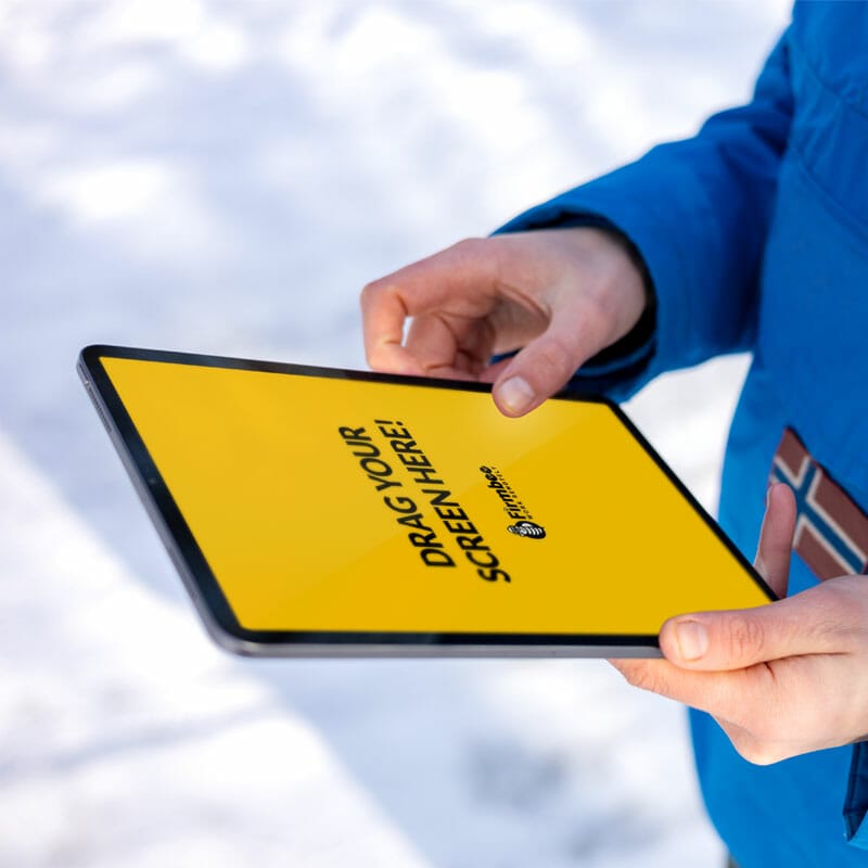 Man In Blue Jacket Uses Apple iPad Free Mockup