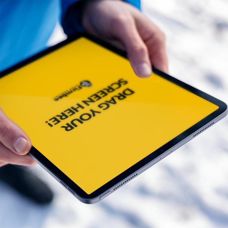 Man Uses Apple iPad Outside In Winter Free Mockup