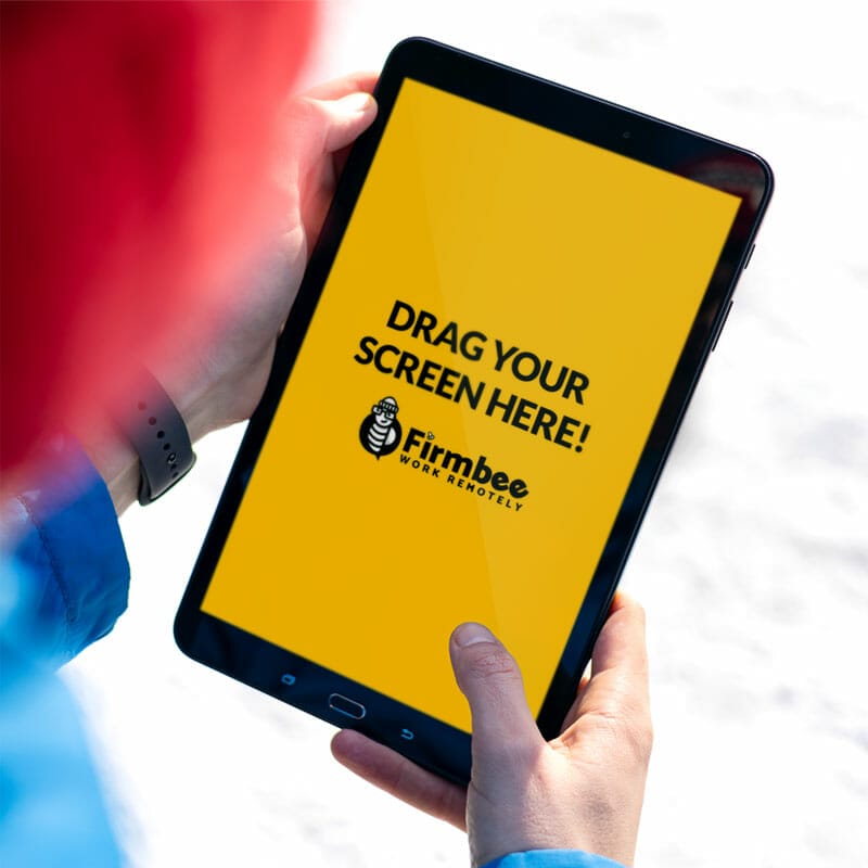 Man Uses Apple iPad Outside In Winter Free Mockup