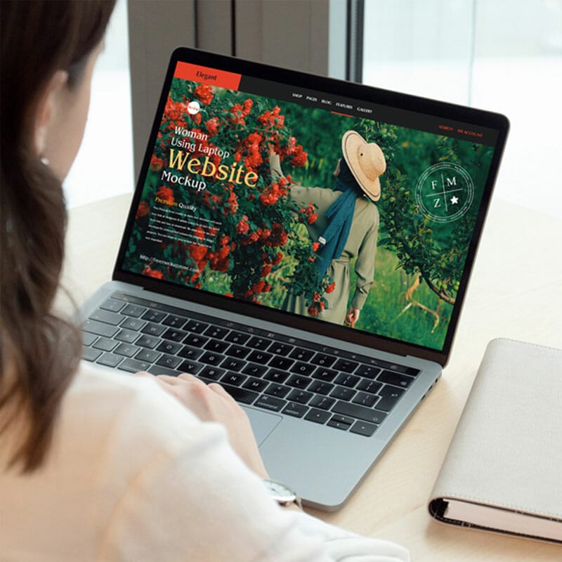 Free Woman Using Laptop Website Mockup