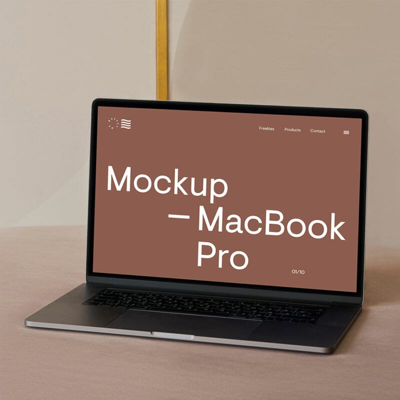 MacBook Pro On A Sofa Mockup