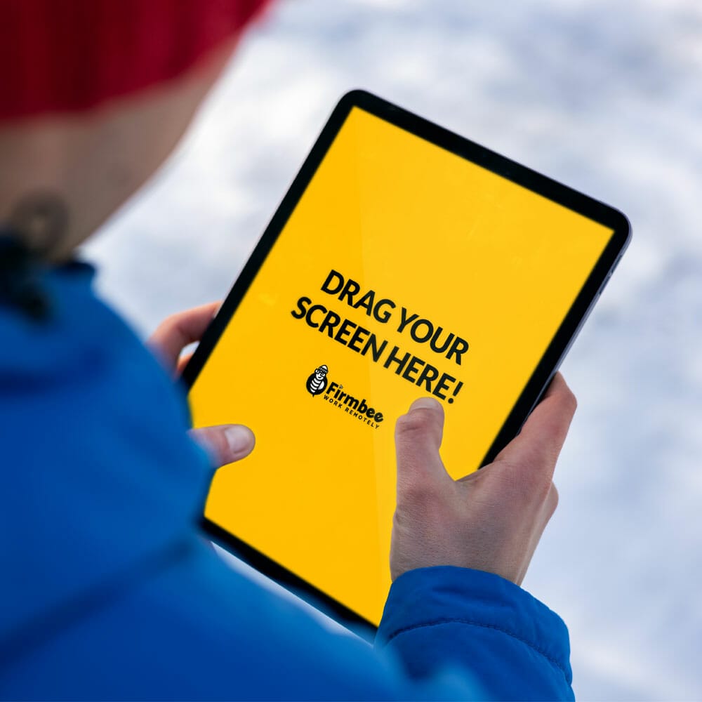Man In Blue Jacket Uses Apple iPad In The Park Free Mockup