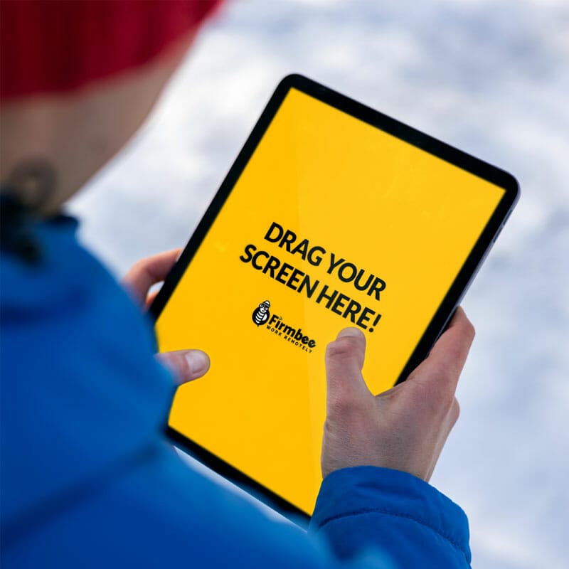 Man In Blue Jacket Uses Apple iPad In The Park Free Mockup