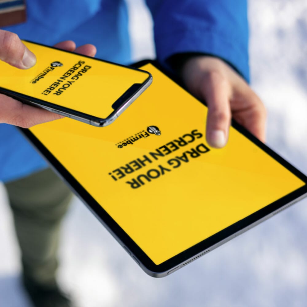 Man Uses Both Apple iPhone And iPad Free Mockup