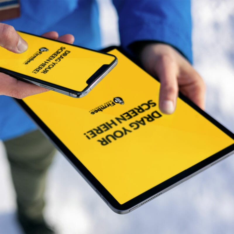 Man Uses Both Apple iPhone And iPad Free Mockup