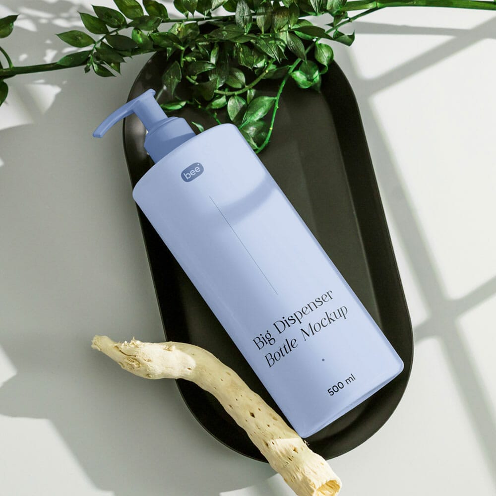 Free Dispenser Bottle With Plant Mockup