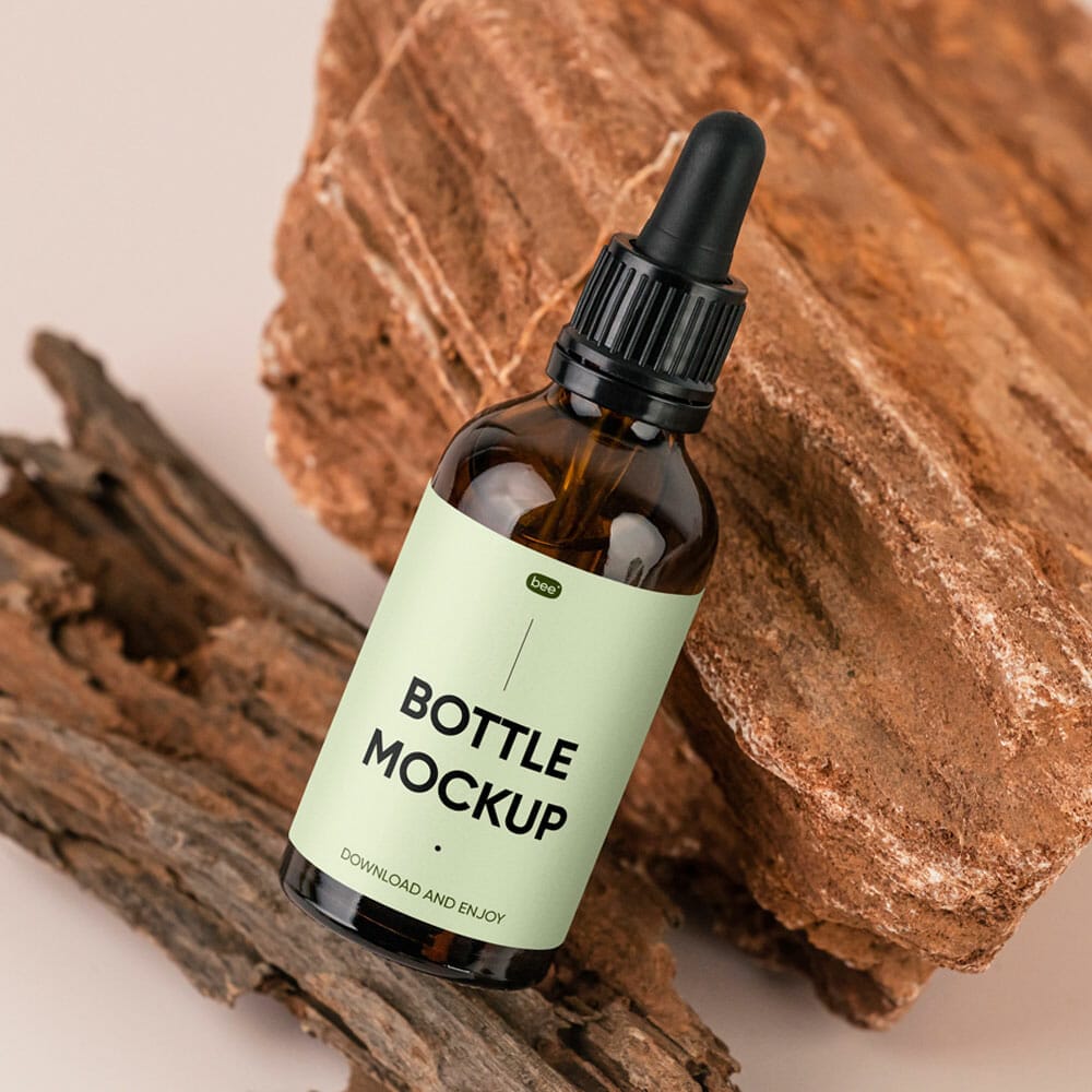 Free Dropper Bottle On Stone Mockup PSD