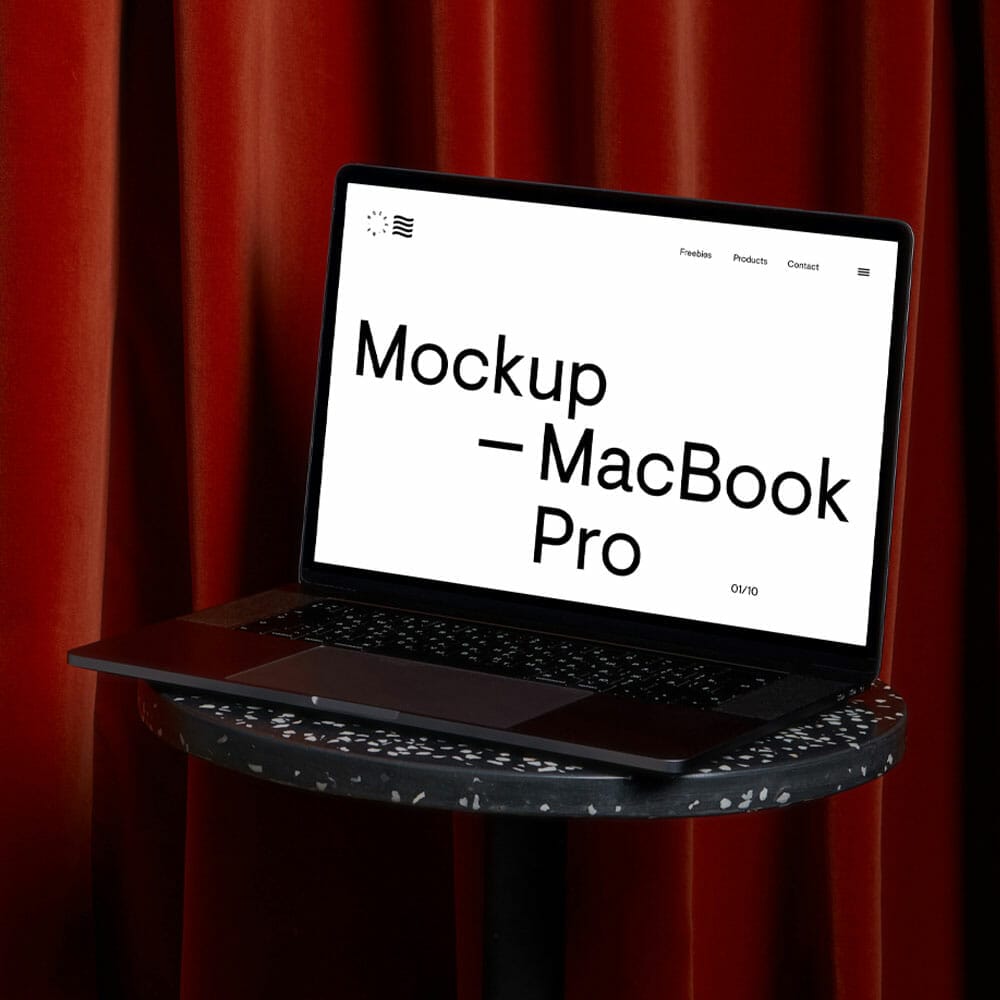 Free MacBook Pro Mockup On Coffee Table
