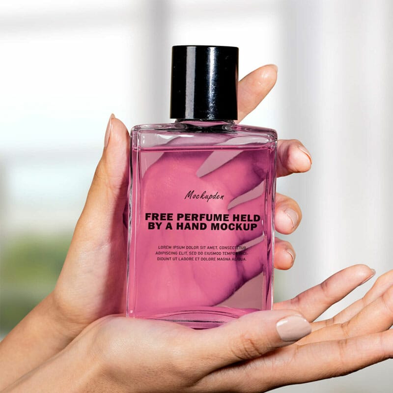 Free Perfume Held By A Hand Mockup PSD Template