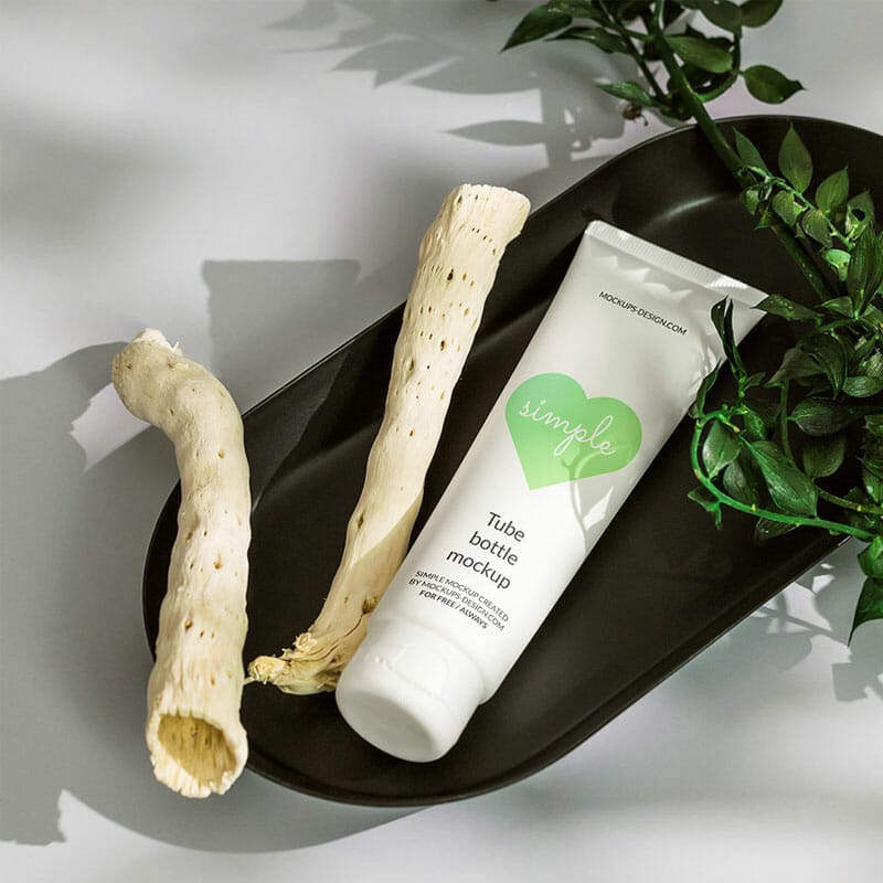 Free Cosmetic Tube In Black Tray Mockup PSD