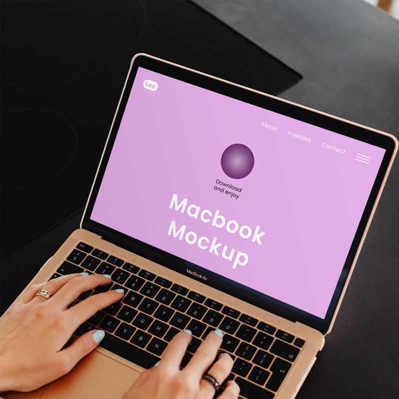 Free Macbook Air With Hands Mockup PSD