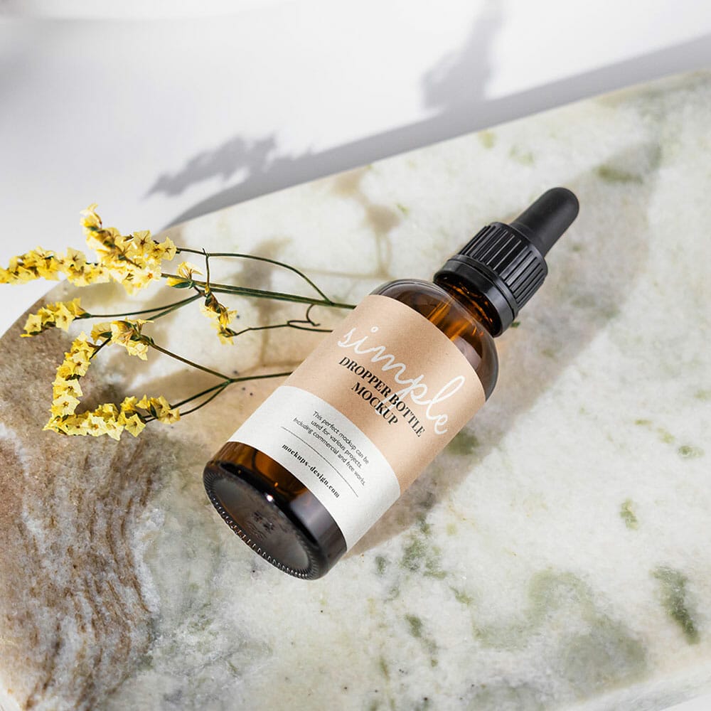 Free Amber Bottle On Marble Tile Mockup PSD