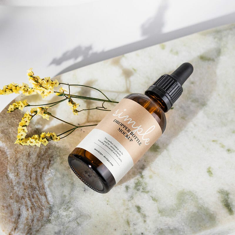 Free Amber Bottle On Marble Tile Mockup PSD