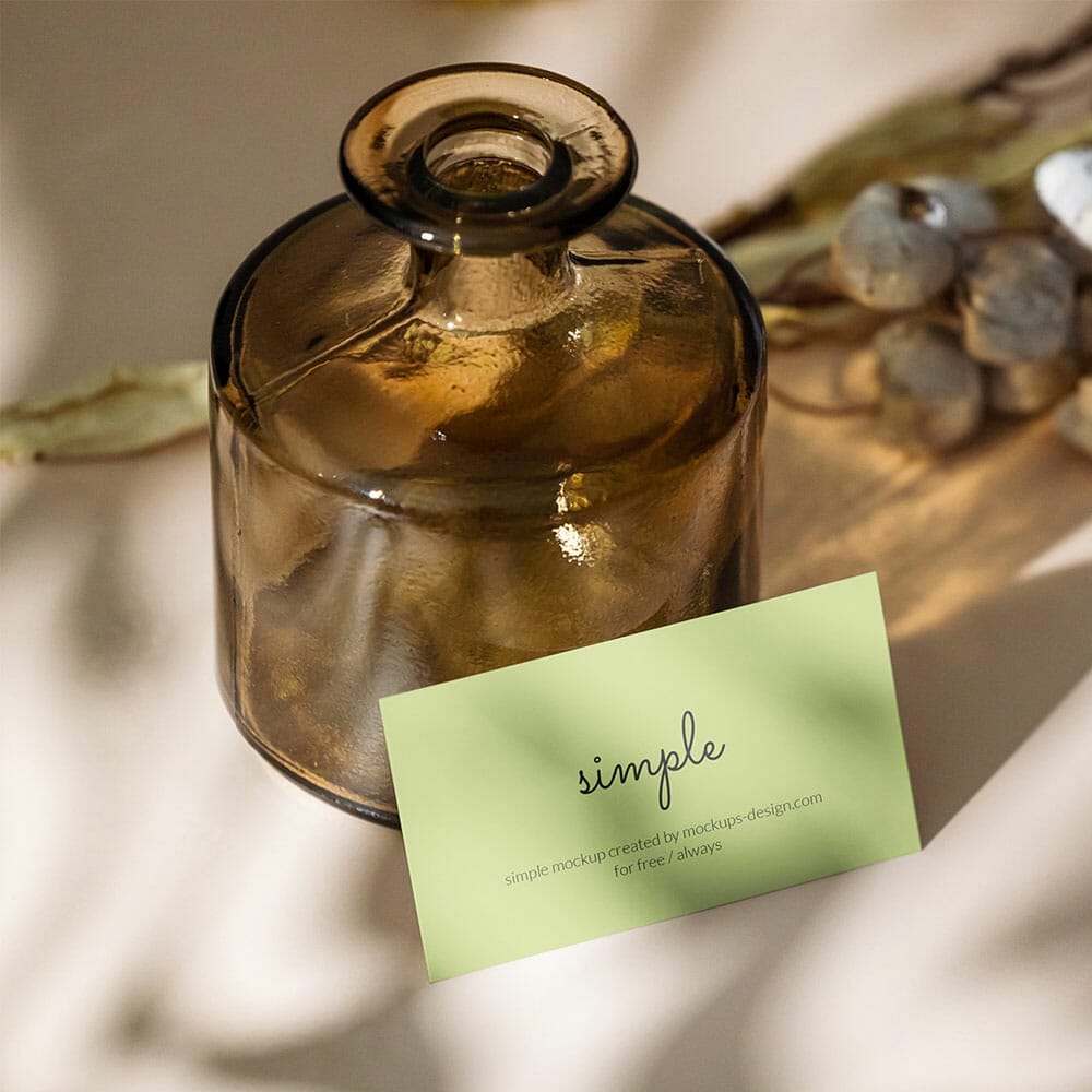 Free Business Card With Dark Bottle Mockup PSD