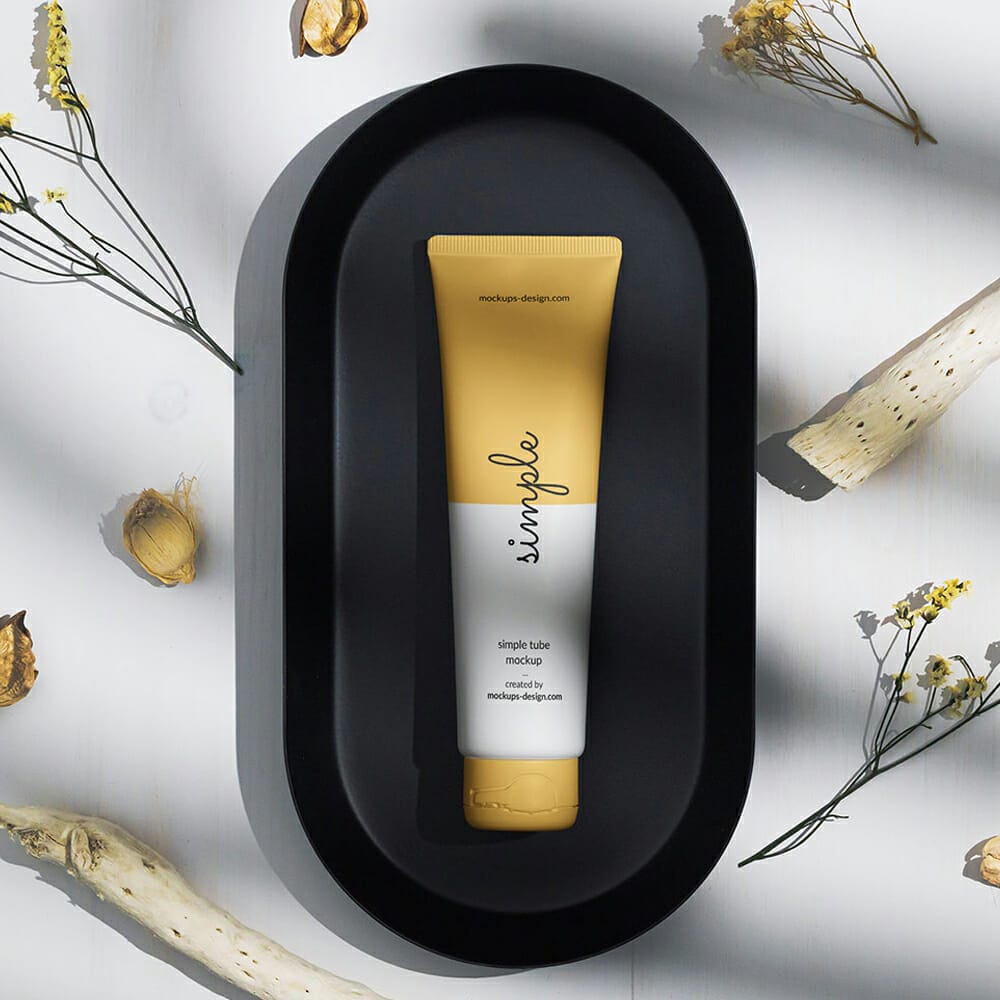 Free Cosmetic Tube On A Black Tray Mockup PSD