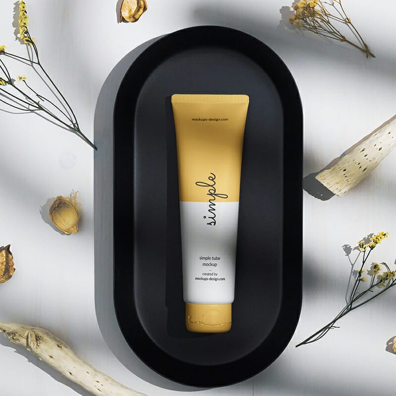 Free Cosmetic Tube On A Black Tray Mockup PSD