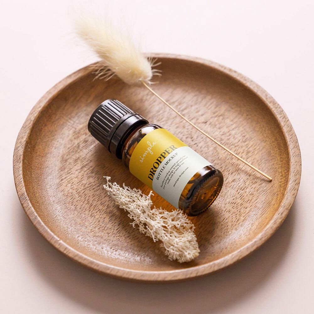 Free Essential Oil Bottle In The Bowl Mockup PSD