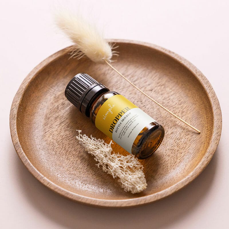 Free Essential Oil Bottle In The Bowl Mockup PSD