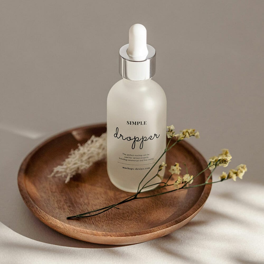 Free Frosted Dropper Bottle On Wooden Tray Mockup PSD