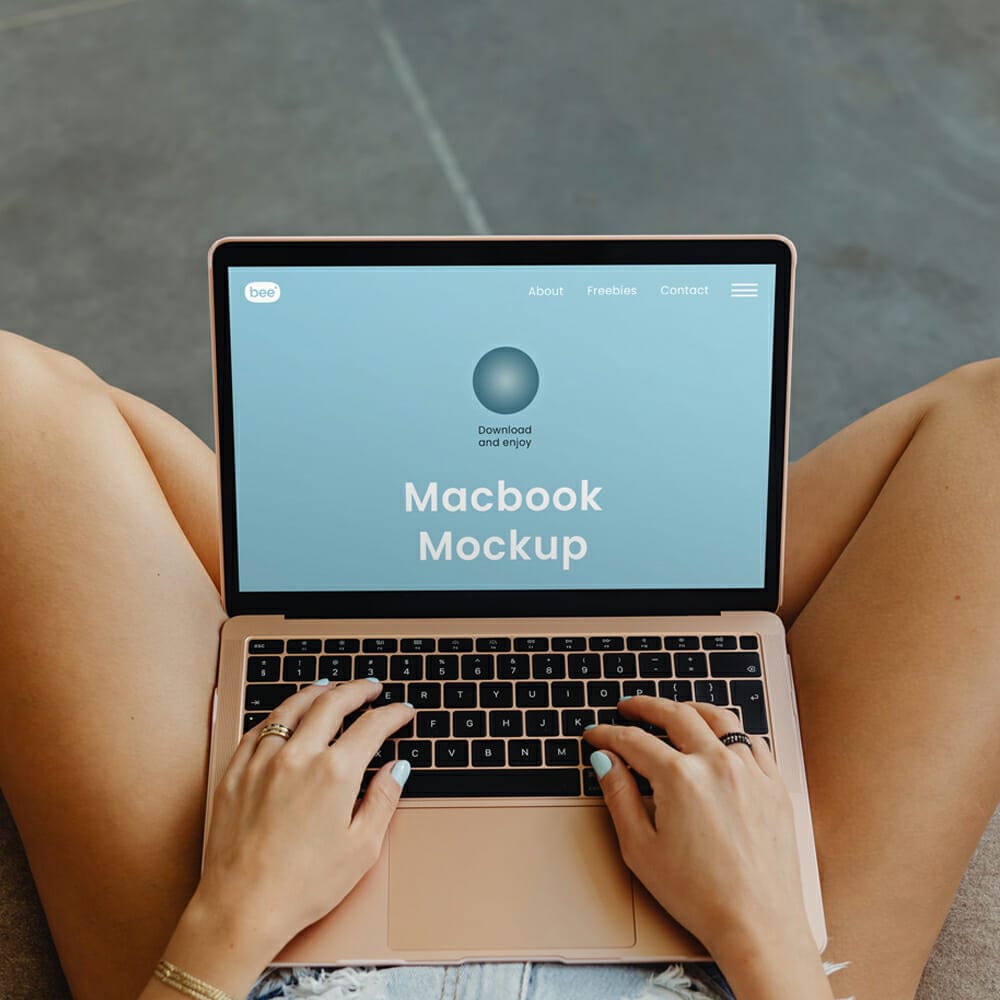 Free MacBook On Legs Mockup PSD