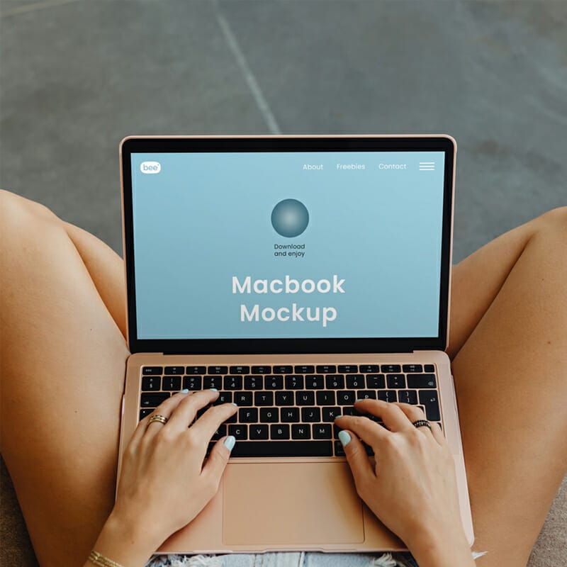 Free MacBook On Legs Mockup PSD