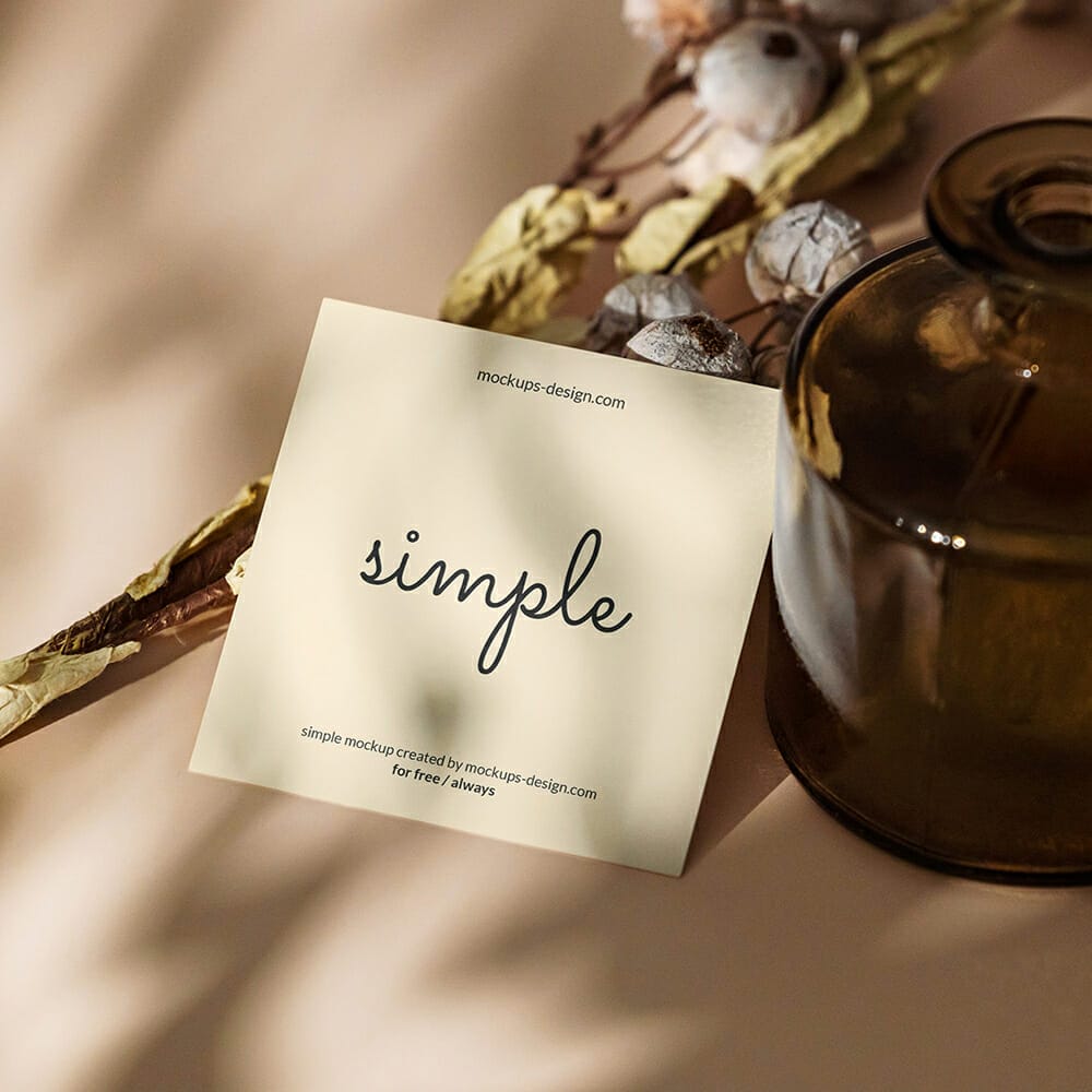 Free Square Flyer With Dark Bottle Mockup PSD