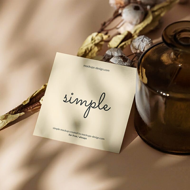 Free Square Flyer With Dark Bottle Mockup PSD