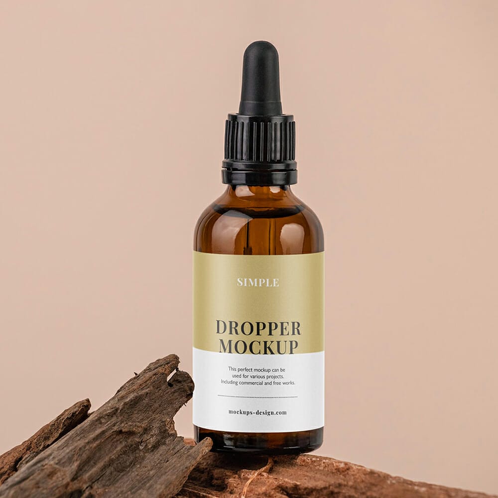 Free Amber Dropper On The Rock Mockup PSD
