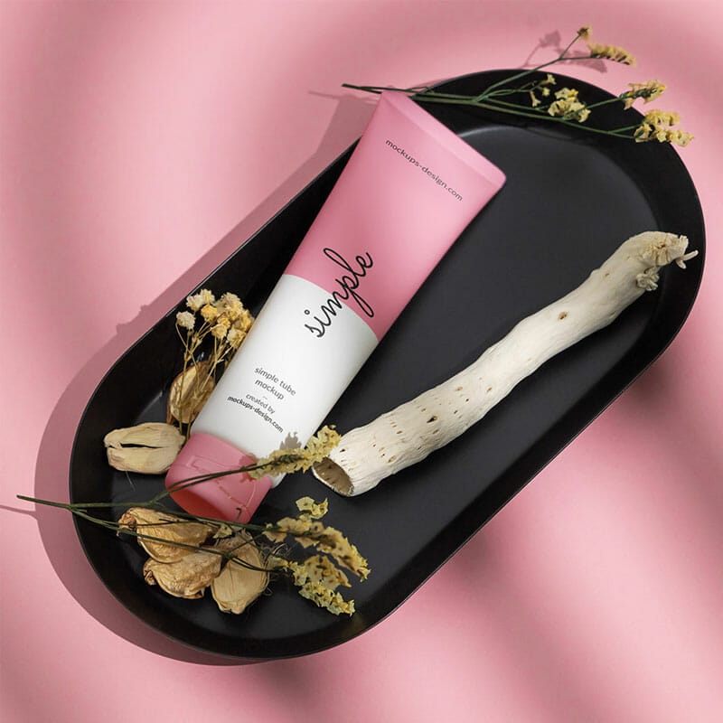 Free Cosmetic Tube On Black Tray Mockup PSD