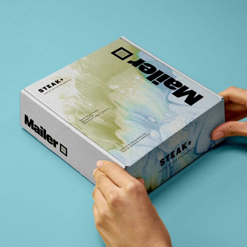 Free Hand Holding Shipping Mailer Box Mockup PSD