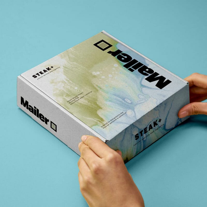 Free Hand Holding Shipping Mailer Box Mockup PSD