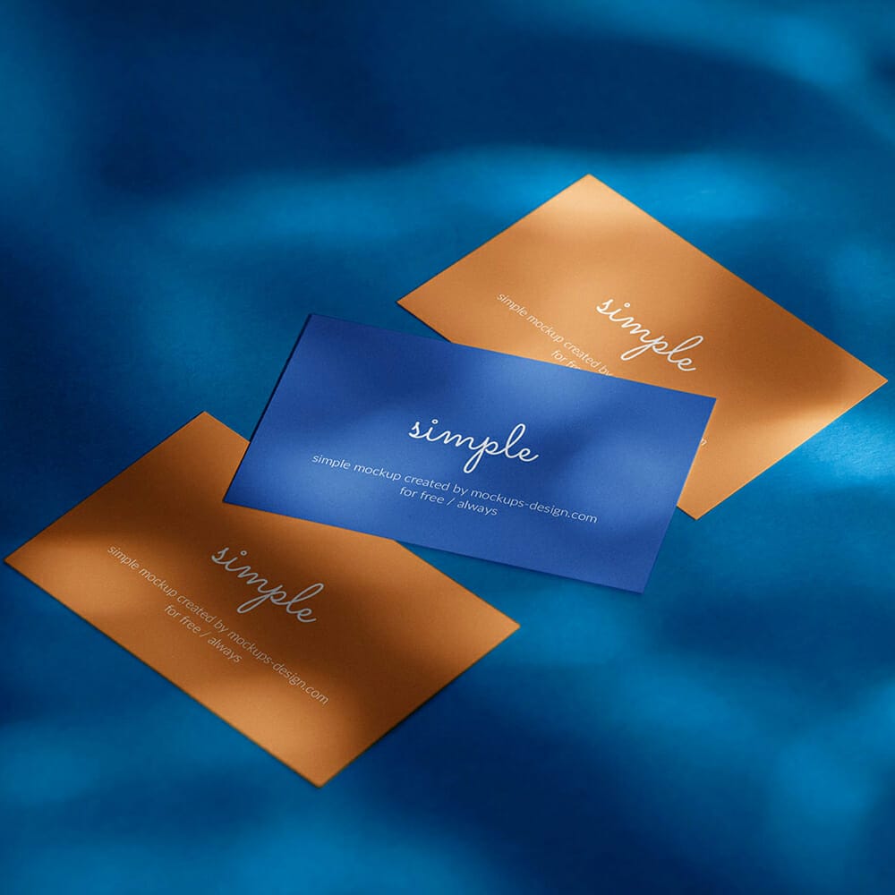 Three Business Cards On Blue Background Mockup PSD