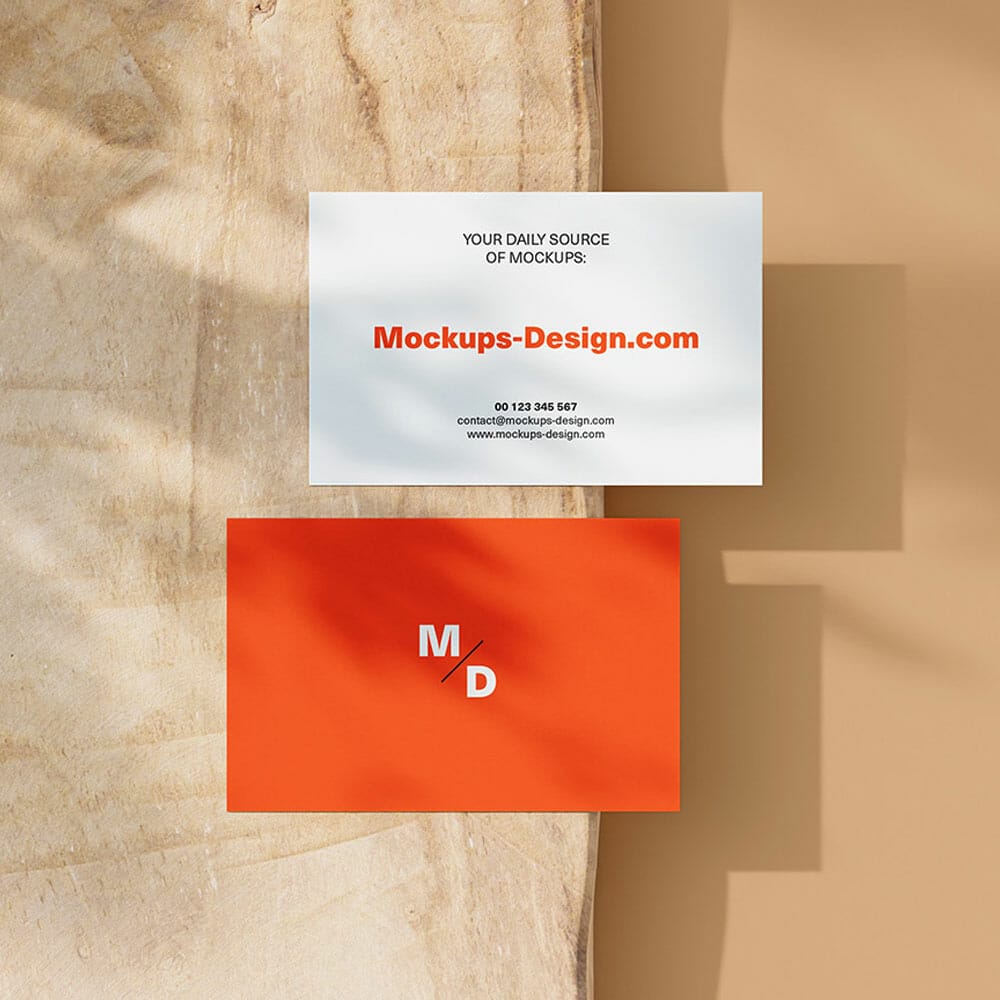 Free Business Cards On A Piece Of Wood Mockup PSD