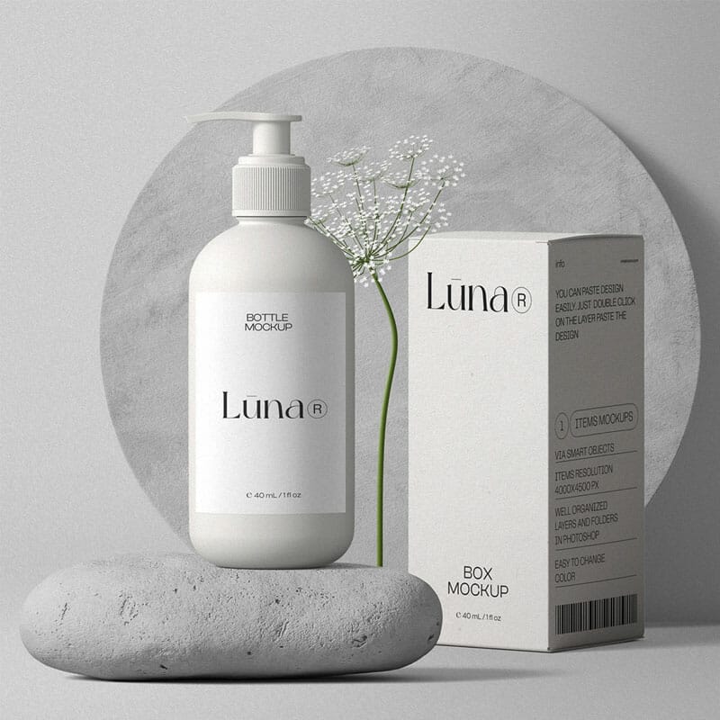 Free Cosmetic Bottle With Pump And Paper Box Mockups On Stone Front View PSD