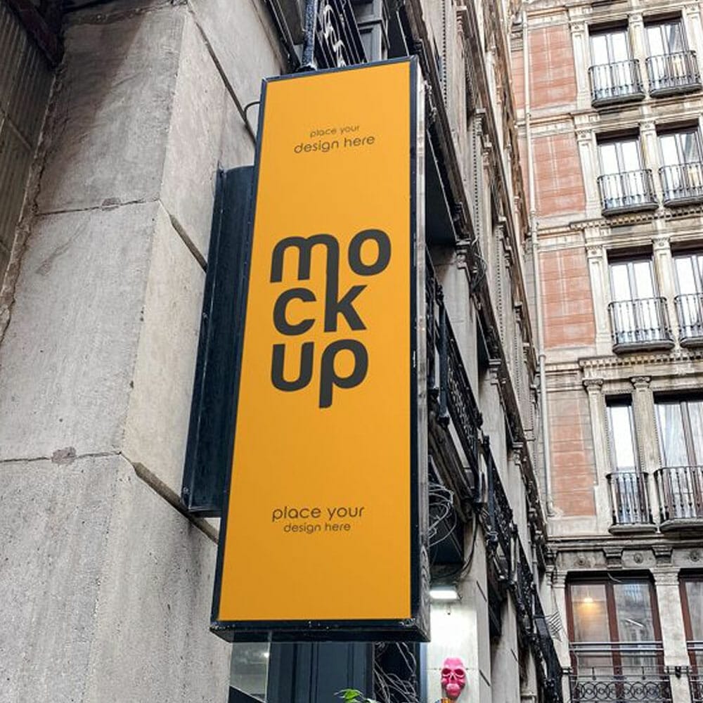 Free Vertical Sign At A Building Mockup PSD