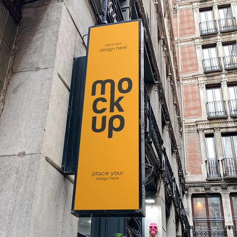 Free Vertical Sign At A Building Mockup PSD