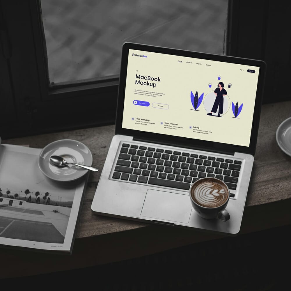 Free MacBook in Cafe Mockup PSD