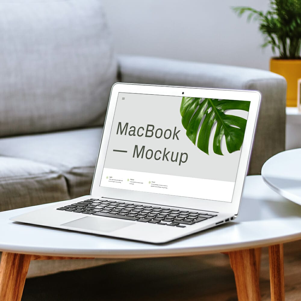 Free MacBook On Table Mockup PSD
