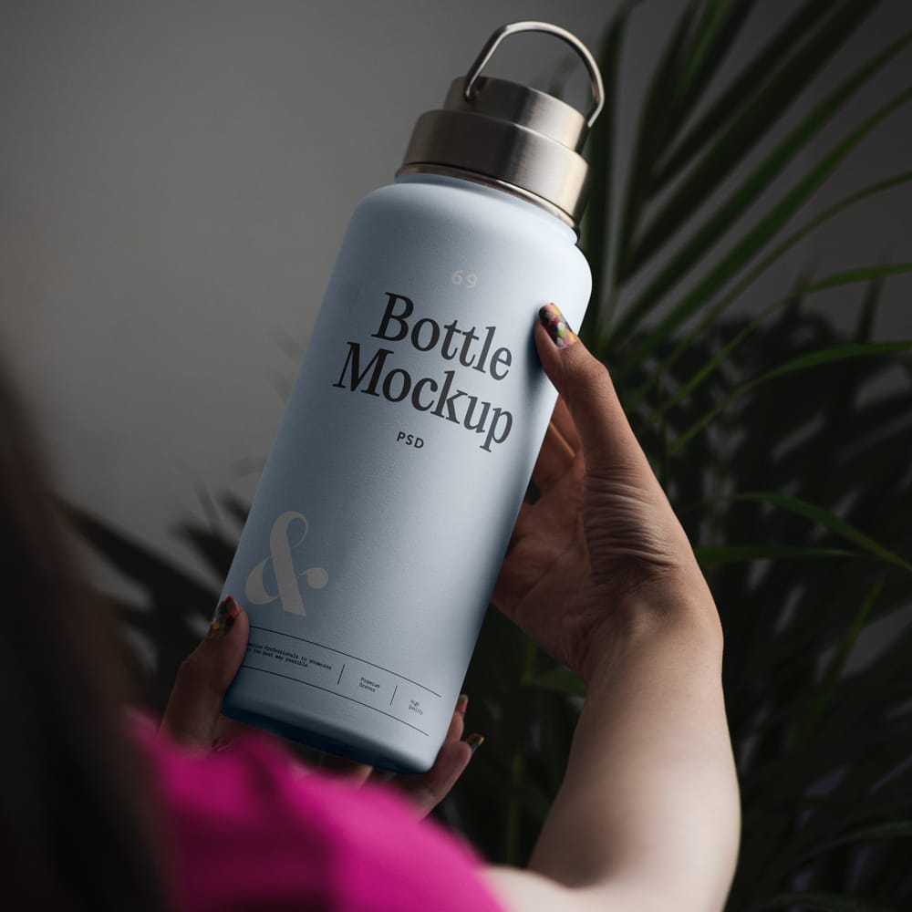 Woman Holding Bottle Mockup PSD
