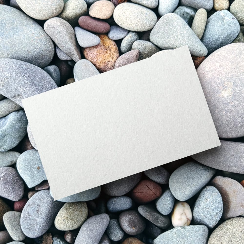 Business Card on Pebbles Mockup PSD