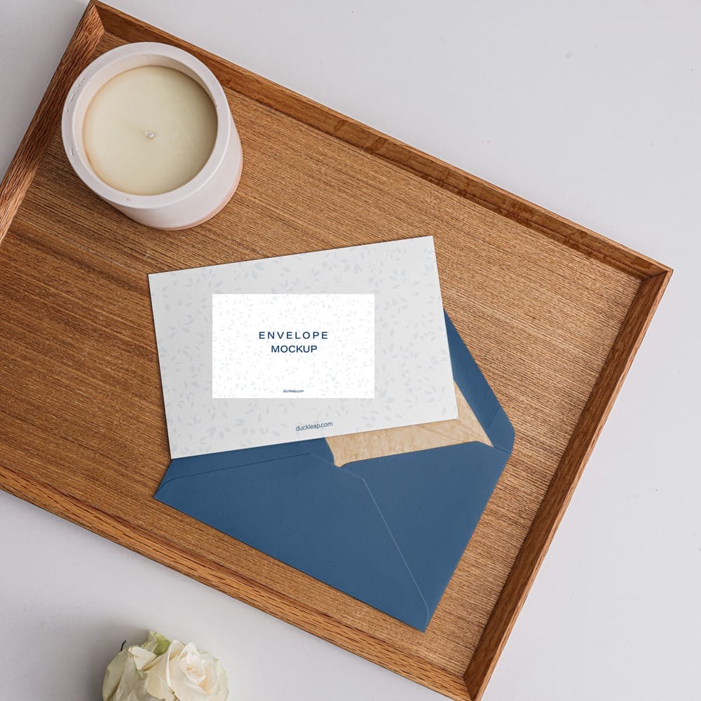 Envelope and Card on a Wooden Tray Mockup PSD