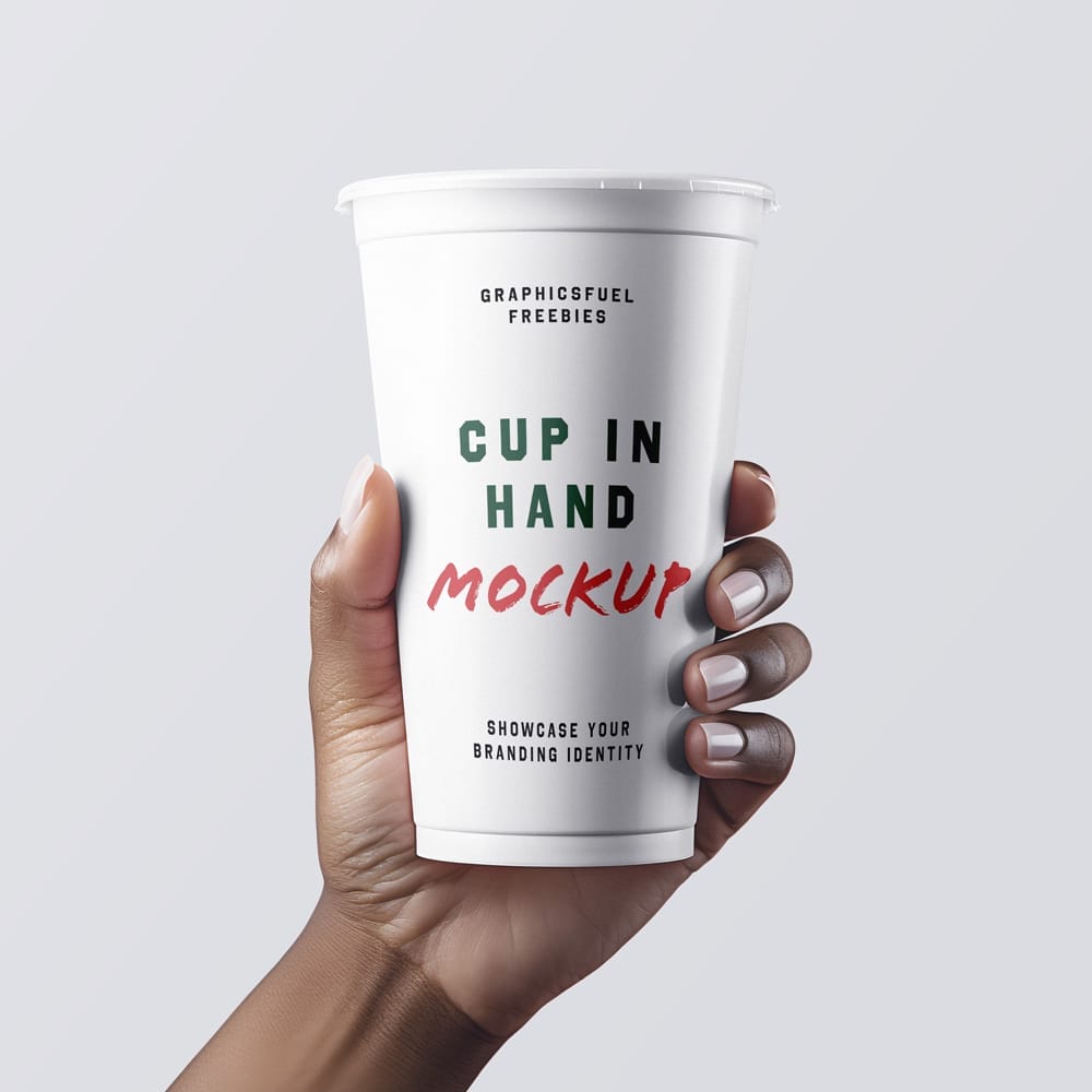 Free Coffee Cup In Hand Mockup Template PSD