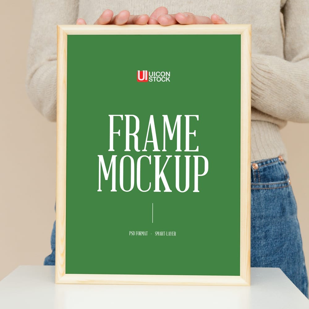 Free Girl Showing Wooden Frame Mockup PSD
