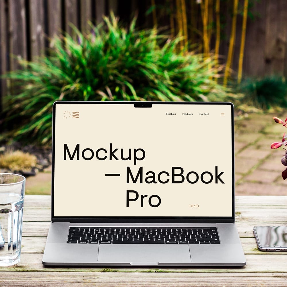 Free MacBook Pro on Wood Desk Mockup PSD