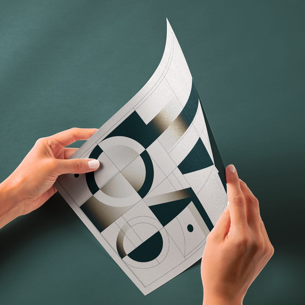 Hand Holding Glossy Paper Mockup PSD