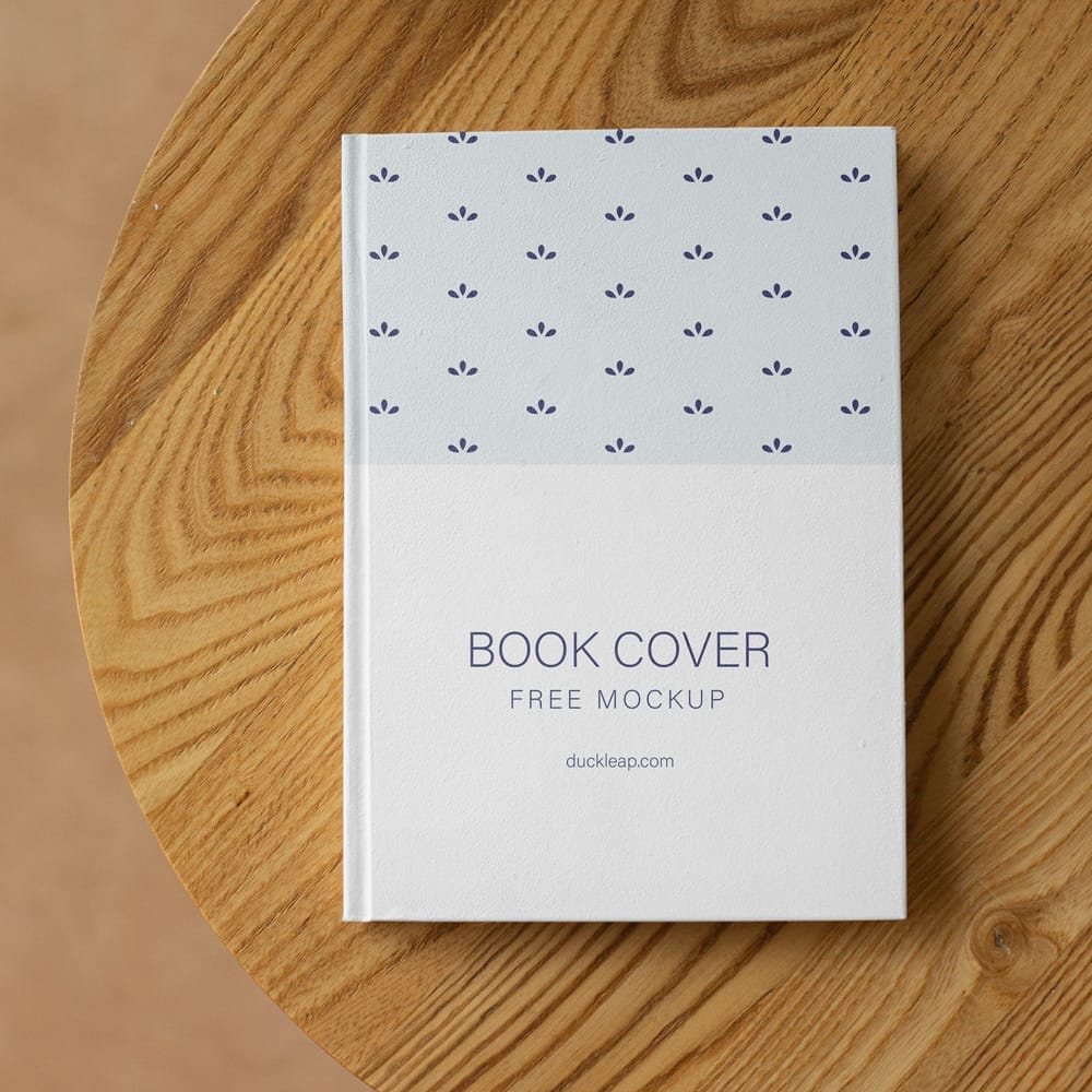 Free Book on a Wooden Table Mockup PSD