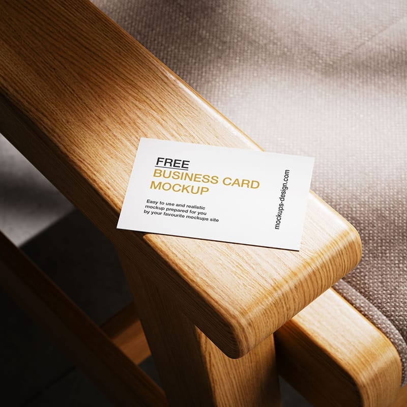 Business Card Lying on Armchair Mockup PSD